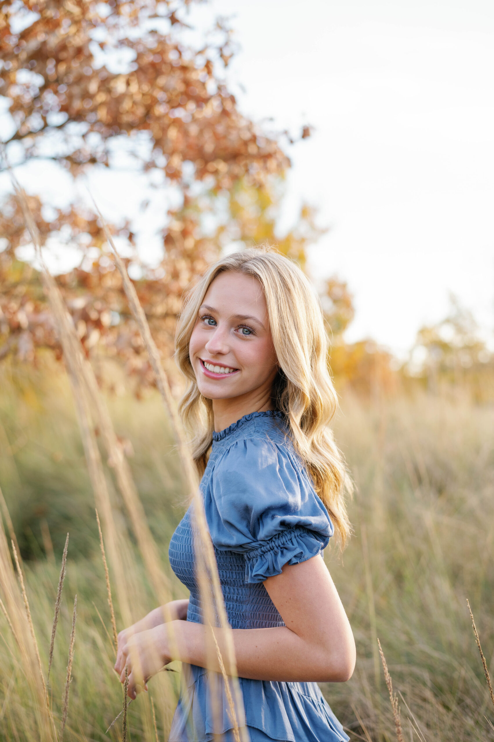 Golden hour fall senior session Raleigh NC Art Museum in tall grass
